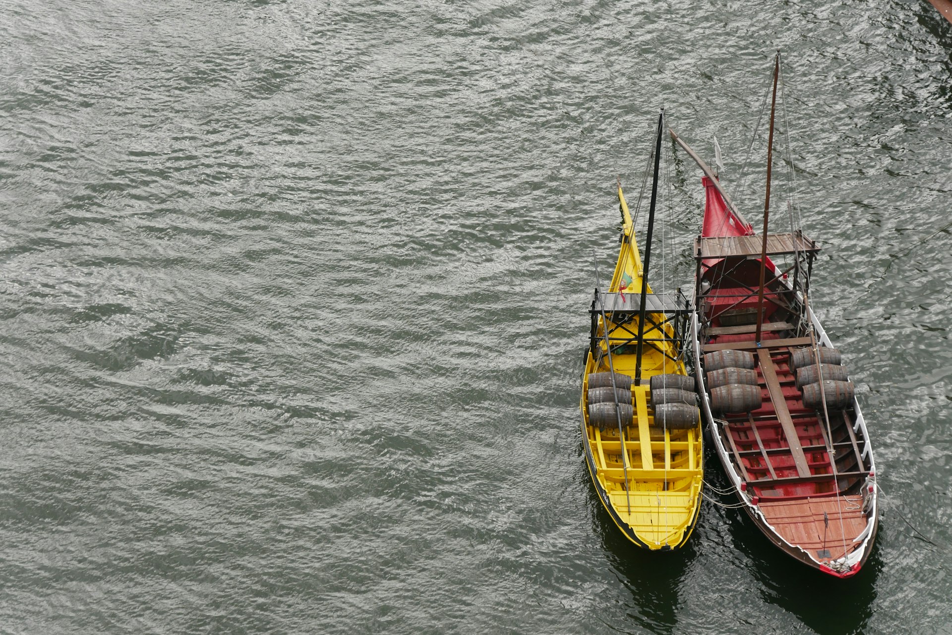 a couple of boats floating on top of a lake